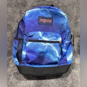 JanSport Cross Town Plus 17" backpack in the "Electric Bolts" print Unisex